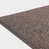 Tummanharmaa VM Carpet Tweed matto. Lähikuva maton kulmasta, josta näkyy kanttaus ja maton materiaali.